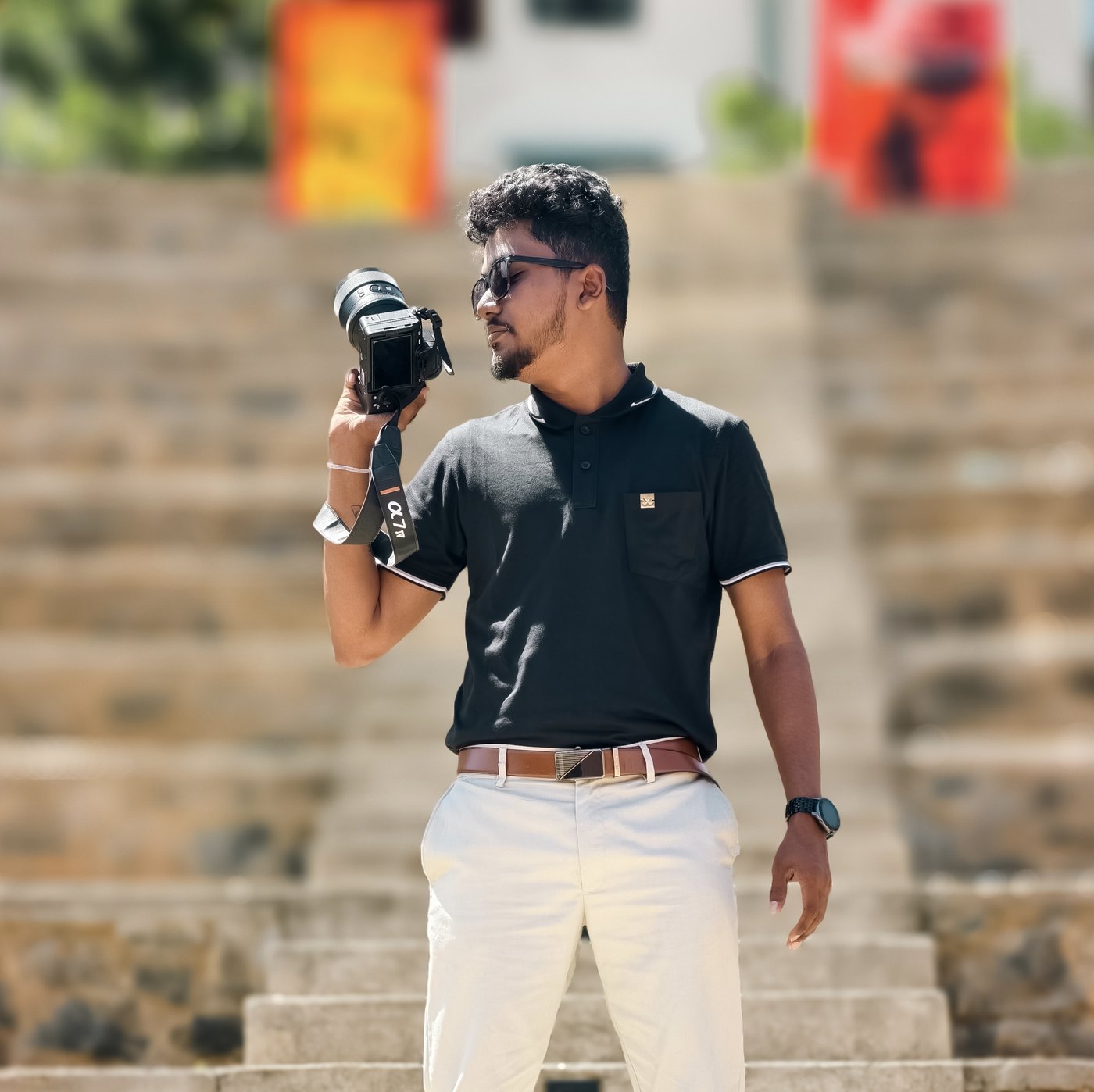 KC Edirisinghe holding a professional camera